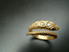 snake with emerald eyes Luxury Snake-shaped Wedding Ring, Elegant Yellow Gold Snake Ring, Formal Snake-shaped Diamond Jewelry, Elegant Snake-shaped Rings For Anniversary, Elegant Snake-shaped Anniversary Rings, Formal Diamond Snake-shaped Ring, Formal Diamond Snake Jewelry, Yellow Gold Snake Ring For Wedding, Snake-shaped Yellow Gold Wedding Ring