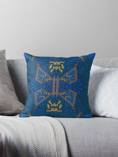 a blue and yellow decorative pillow on a couch