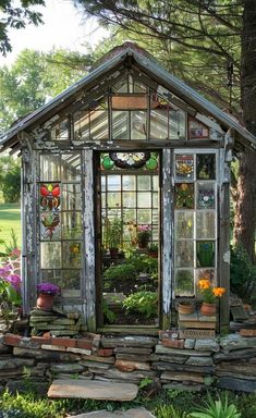 a small wooden building with lots of windows