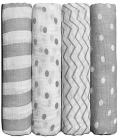 four different types of baby swaddles lined up against each other