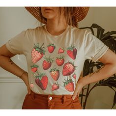 Retro Oversized Strawberry Tee for the fruit lover! Be sure to size up 2 sizes for the oversized look. UNISEX T-SHIRT Bella Canvas These shirts are %100 cotton. Regular Unisex cut and true to size. If you want to get an oversized look please size up 2 to 3 sizes! Organic Short Sleeve T-shirt For Spring, Cottagecore Printed T-shirt With Relaxed Fit, Casual White Tops With Fruit Design, White Casual Top With Fruit Design, Casual Red T-shirt With Fruit Print, Casual White Top With Fruit Design, Organic White Graphic Print Tops, Relaxed Fit T-shirt With Fruit Print For Spring, Organic Cotton T-shirt For Summer