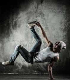 a man is doing a trick on his skateboard in the middle of an empty room