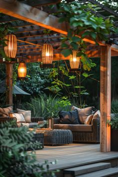 an outdoor living area with couches and lights