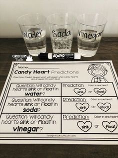 three shot glasses sitting on top of a table next to an activity sheet that says water and soda