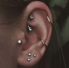 a person with some piercings on their ear