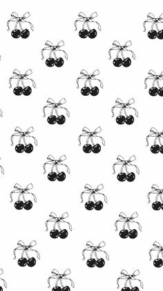 black and white cherries with bows on them