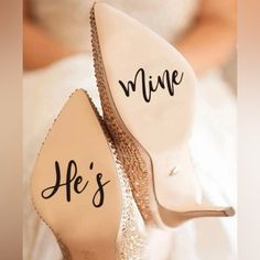 a bride's shoes with the words mine he's on them are shown