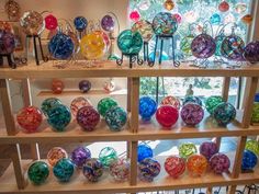 there are many glass balls on the shelves