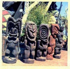 some statues are lined up on the ground