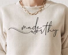 a woman wearing a sweatshirt that says made with thy