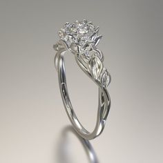 a diamond ring with leaves on it