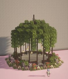 a miniature model of a park with trees and flowers