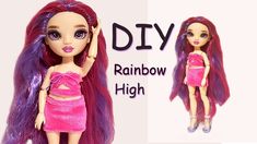 the doll is wearing a pink dress and has long hair with purple streaks on it