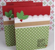 two christmas cards with holly on them, one is red and the other is green