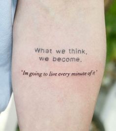 a person with a tattoo saying what we think, we become i'm going to live every minute of it