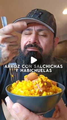 a man with a hot dog and corn in a bowl