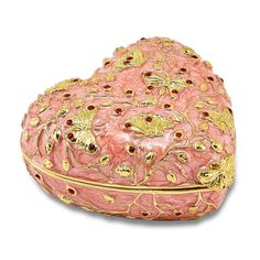 a pink and gold heart shaped box on a white background