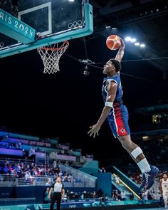 a basketball player dunking the ball into the hoop