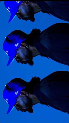 three young men with blue hats on their heads