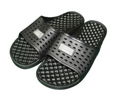 two black slippers with holes on the bottom and one has a white label that says,