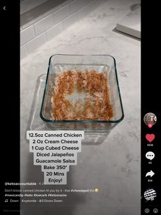 a glass dish filled with food on top of a counter next to a sticker