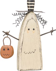 a wooden carving of a ghost with a pumpkin hanging from it's side