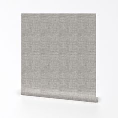 a plain grey fabric wallpaper with a white background