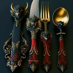 an assortment of silverware with red and gold designs on them, including forks, spoons and knives