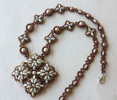 a beaded necklace on a white surface