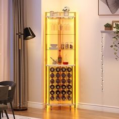 a yellow lighted wine rack in the corner of a room with chairs and a table