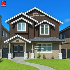 the front of a two story house with brown siding and white trim