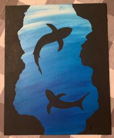 a painting of two dolphins swimming in the ocean