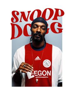 a man in a red and white shirt with a snoop dogg poster behind him on the wall