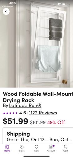 an ad for wood foldable wall - mounted drying rack