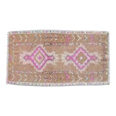 an old rug with pink and white designs on it's edges, against a white background