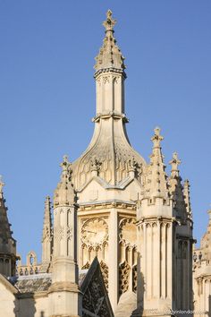 the top of an old building with a clock on it