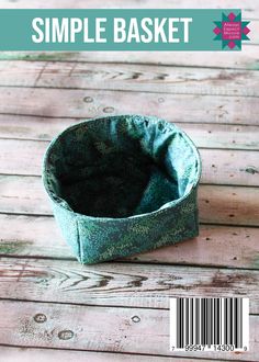 a small basket sitting on top of a wooden table