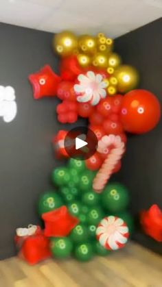 a christmas tree made out of balloons and candy canes is shown in this image