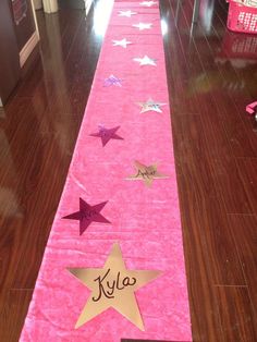 a pink table runner with stars on it