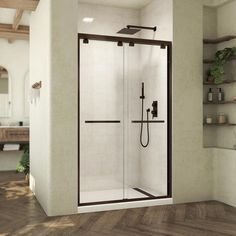 a bathroom with a walk in shower next to a wooden floor and shelves on the wall