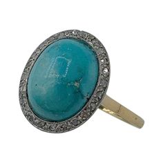 This is a magnificent Antique Victorian - Art Deco Ring with a gorgeous natural Persian Turquoise cabochon of stunning beauty surrounded by a halo of 24 sparkling antique Rose Cut Diamonds in 18 Karat Gold. The Persian Turquoise is a beautiful large domed cabochon gem. I love the subtle color variation within the turquoise. This beautiful gem is surrounded by an elegant halo of 24 sparkling white Rose Cut Diamonds. The combination of Persian Turquoise and Rose Cut Diamonds is the combination everyone dreams of! The jewels are set in White Gold which enhances the color combination of the Persian Turquoise and the antique diamonds. The remainder of the ring is 18 Karat Yellow Gold. This is one of my favorite rings with beautiful antique gems with wonderful warmth and character and quality. P Persian Turquoise Ring, Antique Rings Victorian, Victorian Engagement Rings, Edwardian Ring, Contemporary Engagement Rings, Persian Turquoise, Rosecut Diamond Ring, Engagement Ring Diamond Cut, Victorian Rings