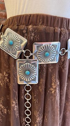 Elevate your western look with our Silver Concho Belt. Crafted from thick silver metal, this belt features intricate turquoise details for added boho vibes. Perfect for adding a touch of unique style to any outfit. Upgrade your accessories game with this statement piece. Two sizes - S/M = 41" L/XL = 45" Rebecca James, Concho Belt, Western Look, Boho Vibe, Pet Hair, Sale Items, Statement Pieces, Unique Style, Metallic Silver