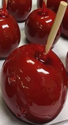 several red apples with toothpicks stuck in them