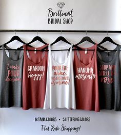 four women's tank tops hanging on a rack with the words brilliant bridal shop