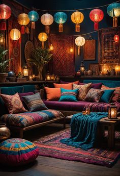 a living room filled with lots of furniture and lanterns hanging from the ceiling above it