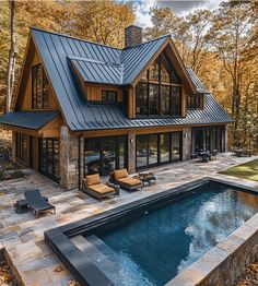 a house with a swimming pool in the front yard and covered patio area next to it