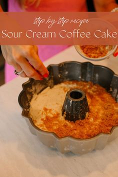 a cake pan that has some food in it and the words sour cream coffee cake on top