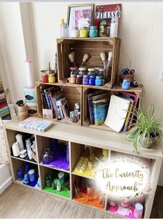 a wooden shelf filled with lots of craft supplies