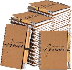 a stack of notebooks with writing on them next to a ballpoint pen that says, thank you for being awesome