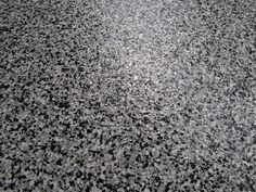 a black and white photo of granite flooring